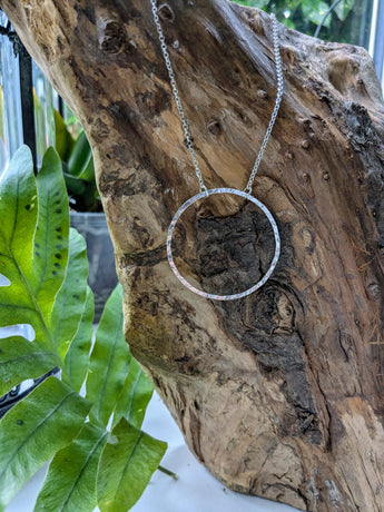 Hammered circle pendant