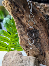 Long multi hoop pendant