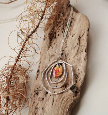 Hammered hoop pendant with enamel center.  (three variations)