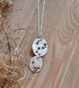 Hammered disc pendant with copper dots