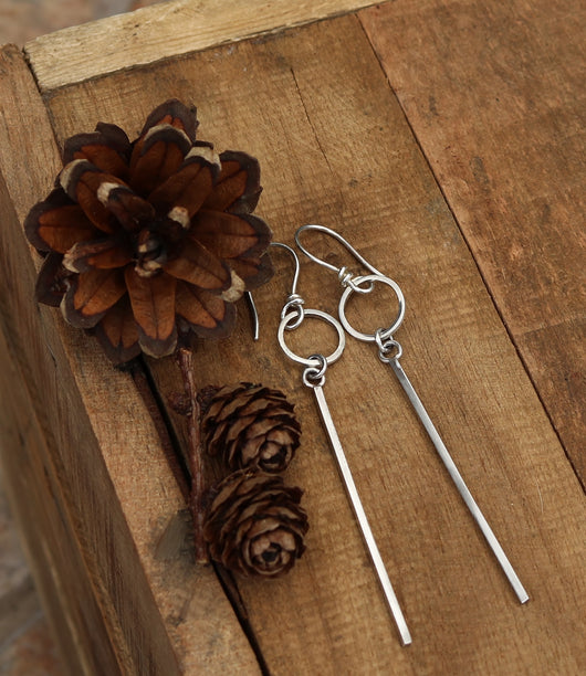 Contemporary long drop earrings