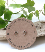 Bass clef studs.  Two variations