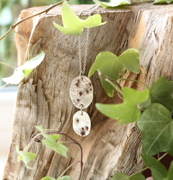 Hammered disc pendant with copper dots