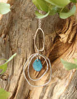 Hammered hoop pendant with enamel center.  (three variations)