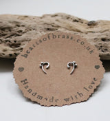 Bass clef studs.  Two variations