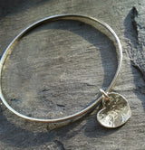 Sterling silver bangle, with hammered heart pendant